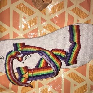 I’m selling sandals. They are rainbow. The sandals are a size 8W